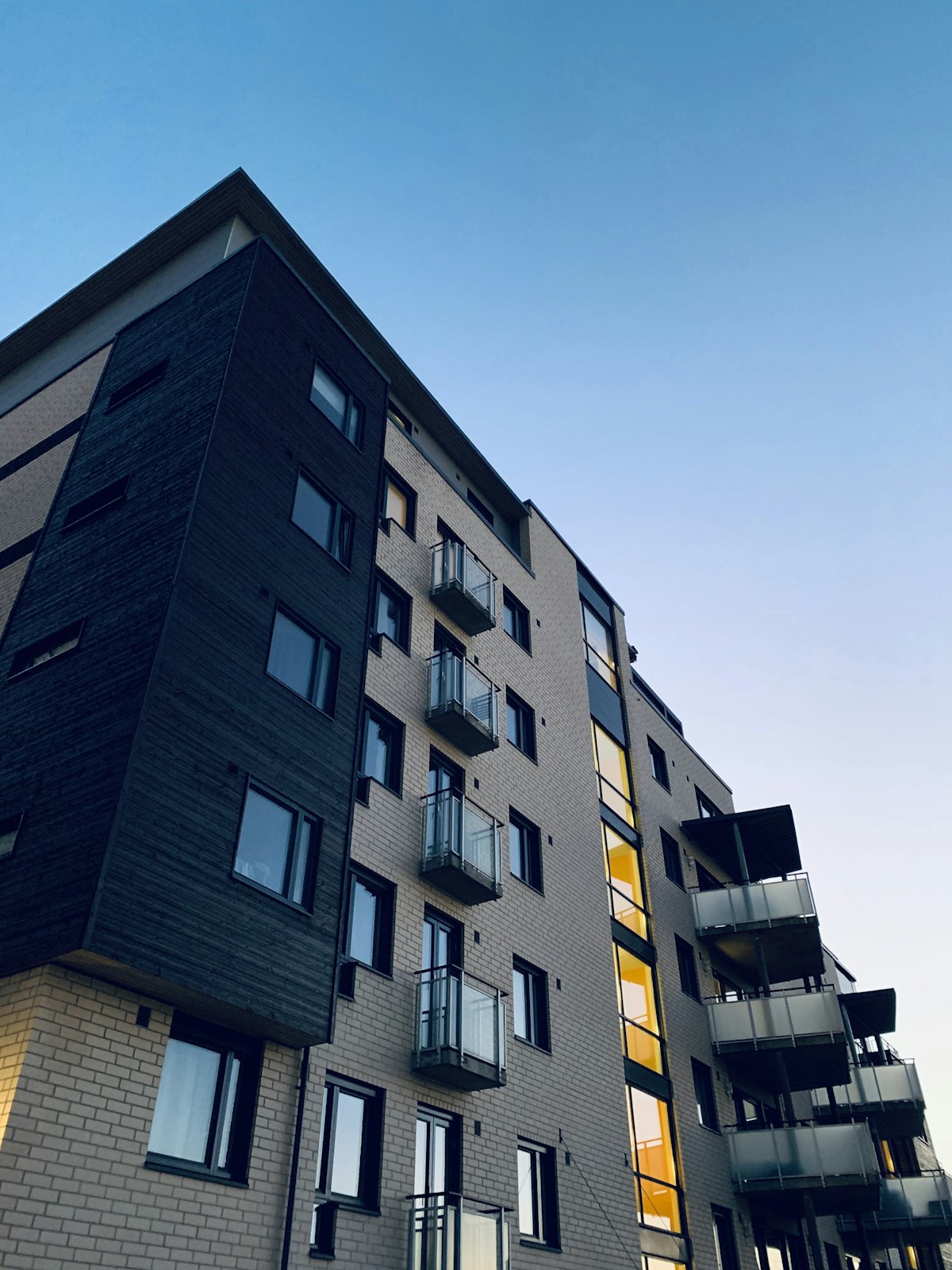 Modern apartment building with balconies and large windows